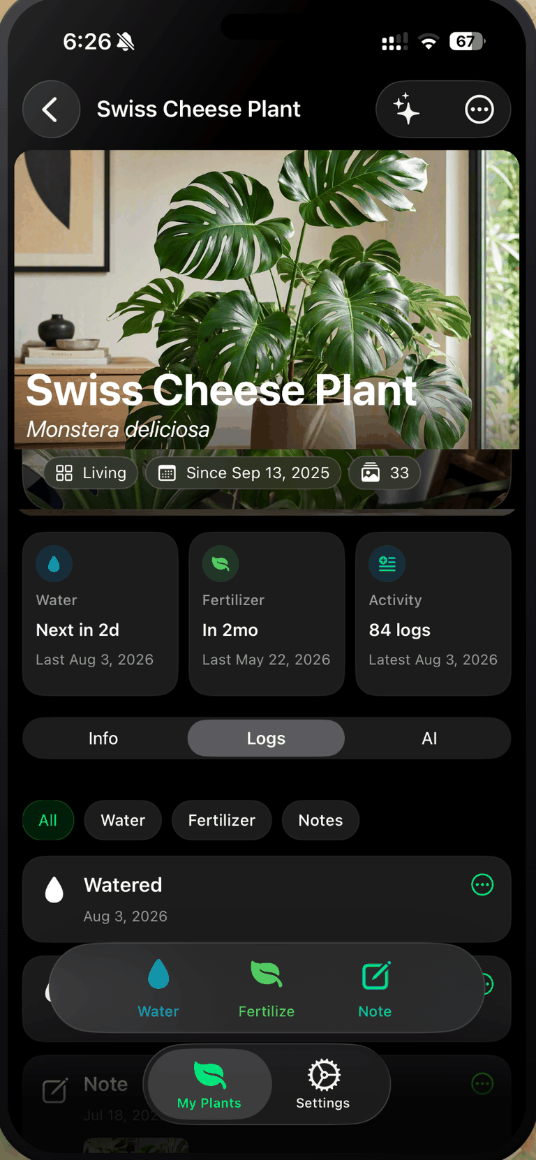 The Plant Assistant plant screen on iPhone for a Swiss Cheese Plant, Monstera deliciosa, in the Living room, kept since Sep 13, 2025, with 33 photos. Cards read Water next in 2d, last Aug 3, 2026; Fertilizer in 2mo, last May 22, 2026; Activity 84 logs, latest Aug 3, 2026. The Logs tab is open with filters for All, Water, Fertilizer and Notes above an entry reading Watered, Aug 3, 2026.